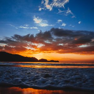 view of the beach and sky in the sunset