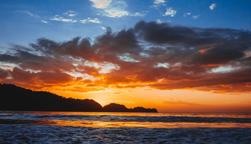 view of the beach and sky in the sunset