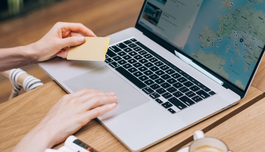 a woman booking a vacation on laptop